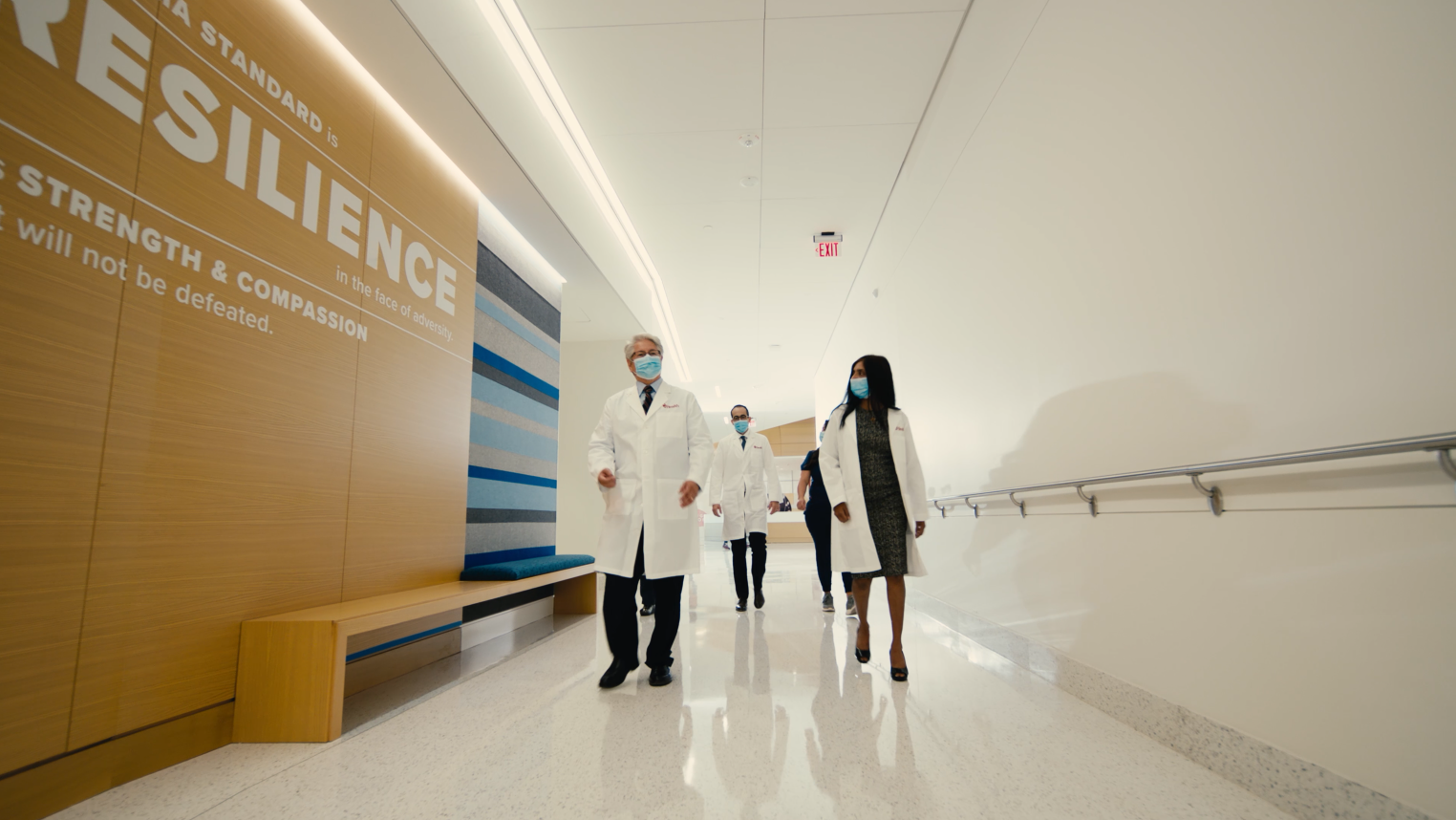 Physicians walk down a hallway at OU Health