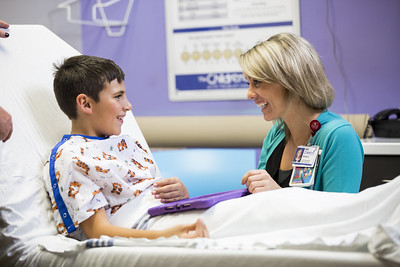 Child LIfe specialist with patient in hospital setting